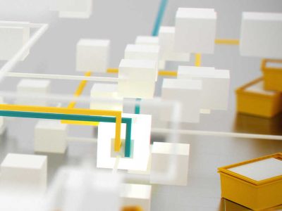 Grafische Darstellung von weißen Würfeln und gelben Kästen, die Datenstrukturen symbolisieren.